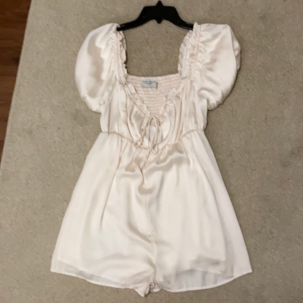Cream romper size small never worn